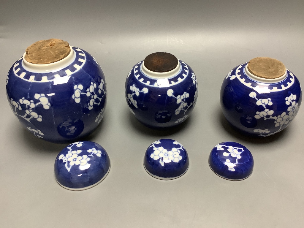 A Chinese enamelled porcelain baluster vase and three Chinese prunus blossom ginger jars, tallest 39cm